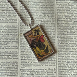 Bugs Bunny and Daffy Duck, vintage 1970s comic illustration, upcycled to soldered hand-soldered glass pendant