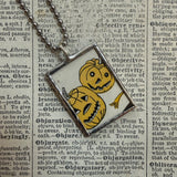 Pumpkins, jack-o-lanterns, vintage children's book illustrations, upcycled to soldered glass pendant