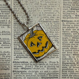Pumpkins, jack-o-lanterns, vintage children's book illustrations, upcycled to soldered glass pendant