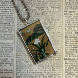 White peony and iris illustrations up-cycled to soldered glass pendant