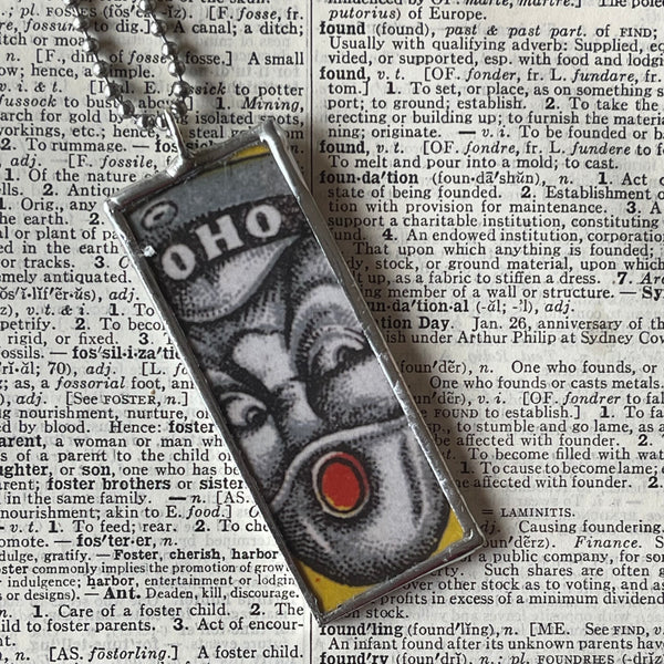 1 Optical illusion faces, vintage illustrations upcycled from vintage Indian matchbooks, upcycled hand soldered glass pendant
