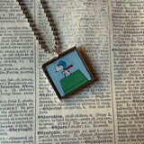 Snoopy, comic strip illustrations from vintage Peanuts book, up-cycled to hand-soldered glass pendant