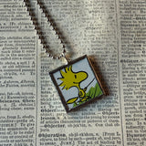 Snoopy and Woodstock, comic strip illustrations from vintage Peanuts book, up-cycled to hand-soldered glass pendant