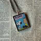 Snoopy, comic strip illustrations from vintage Peanuts book, up-cycled to hand-soldered glass pendant