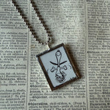 Snoopy, comic strip illustrations from vintage Peanuts book, up-cycled to hand-soldered glass pendant