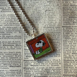Snoopy, comic strip illustrations from vintage Peanuts book, up-cycled to hand-soldered glass pendant