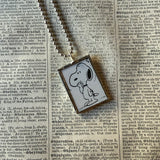 Snoopy, comic strip illustrations from vintage Peanuts book, up-cycled to hand-soldered glass pendant