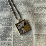 Snoopy, comic strip illustrations from vintage Peanuts book, up-cycled to hand-soldered glass pendant