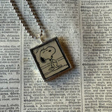 Snoopy, comic strip illustrations from vintage Peanuts book, up-cycled to hand-soldered glass pendant