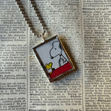 Snoopy, comic strip illustrations from vintage Peanuts book, up-cycled to hand-soldered glass pendant