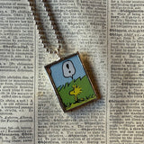 Snoopy, comic strip illustrations from vintage Peanuts book, up-cycled to hand-soldered glass pendant