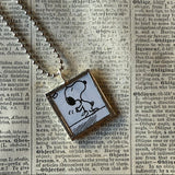 Snoopy, comic strip illustrations from vintage Peanuts book, up-cycled to hand-soldered glass pendant