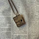 Snoopy, comic strip illustrations from vintage Peanuts book, up-cycled to hand-soldered glass pendant