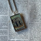 Elephant and Lion vintage Loteria card illustrations, up-cycled to soldered glass pendant