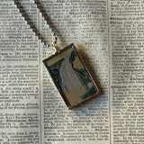 White crane and waterfall illustrations up-cycled to soldered glass pendant