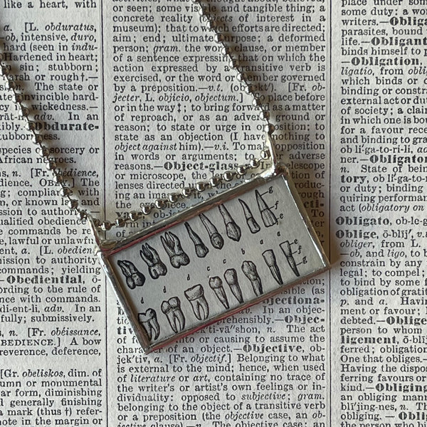 1 Human teeth, dictionary illustration, up-cycled to soldered glass pendant