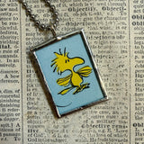 Snoopy and Woodstock, comic strip illustrations from vintage Peanuts book, up-cycled to hand-soldered glass pendant