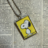 Snoopy and Woodstock, comic strip illustrations from vintage Peanuts book, up-cycled to hand-soldered glass pendant