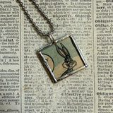 Bugs Bunny and Daffy Duck vintage 1970s comic illustration, upcycled to soldered hand-soldered glass pendant