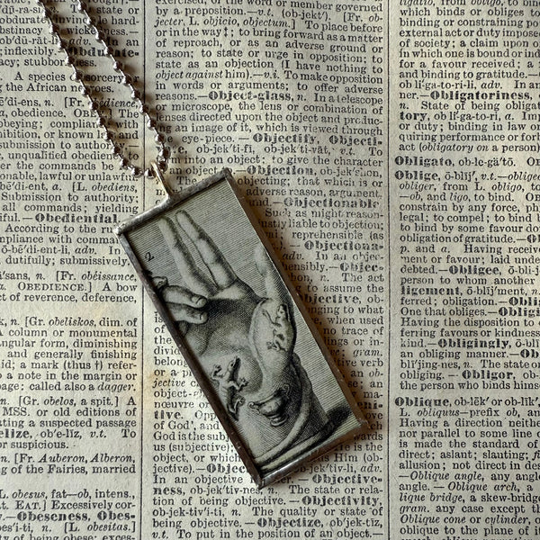 Anatomical Hand, skulls, vintage illustrations upcycled to hand-soldered glass pendant