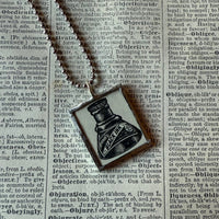 Ink bottle, advertising illustrations up-cycled to soldered glass pendant