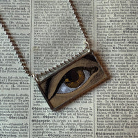 Human eye, vintage illustration upcycled to hand-soldered glass pendant