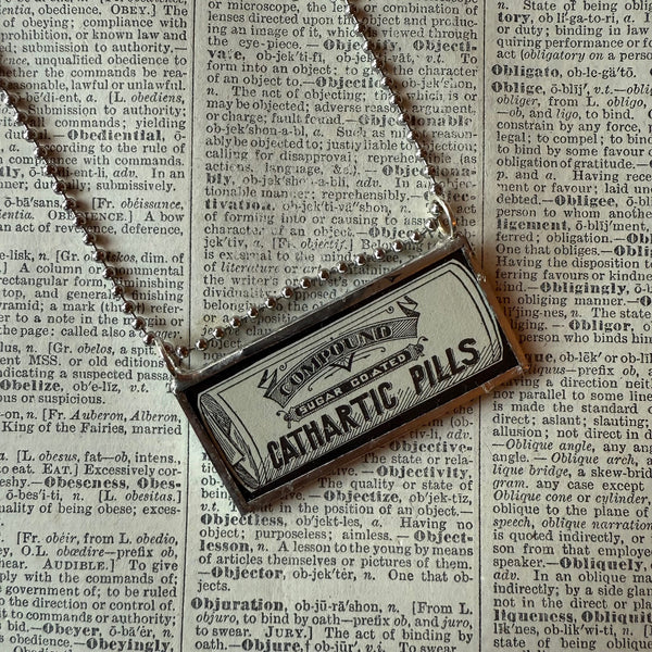 Vintage Cathartic Pills, vintage Sears Catalog illustrations, upcycled to hand soldered glass pendant
