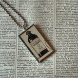 Poison bottle, vintage illustration up-cycled to soldered glass pendant