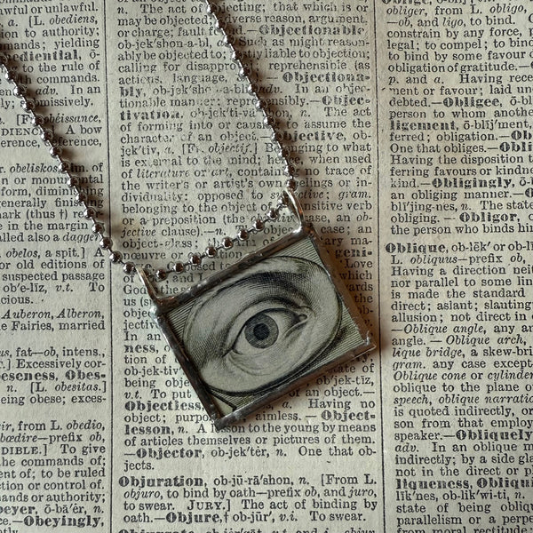 Human eye, vintage illustration upcycled to hand-soldered glass pendant