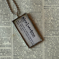 Anatomical skeleton, vintage illustrations upcycled to hand-soldered glass pendant