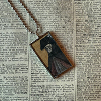 Fancy skeletons, vintage halloween illustrations, up-cycled to soldered glass pendant