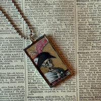 Fancy skeletons, vintage halloween illustrations, up-cycled to soldered glass pendant