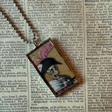 Fancy skeletons, vintage halloween illustrations, up-cycled to soldered glass pendant