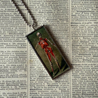 Anatomical skeleton, vintage illustrations upcycled to hand-soldered glass pendant