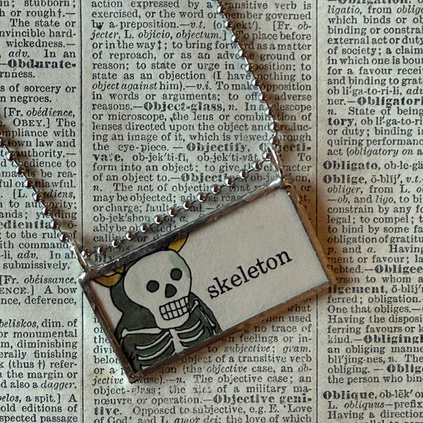 Skeleton, pumpkin vintage illustrations upcycled to hand-soldered glass pendant