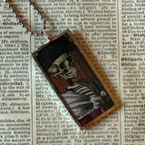 Fancy skeletons, vintage halloween illustrations, up-cycled to soldered glass pendant