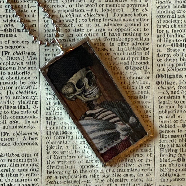 Fancy skeletons, vintage halloween illustrations, up-cycled to soldered glass pendant