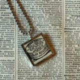 Skeleton, rat poison, advertising illustrations up-cycled to soldered glass pendant