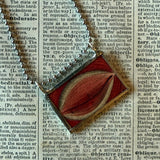 Human eye, vintage anatomical illustrations upcycled to hand-soldered glass pendant