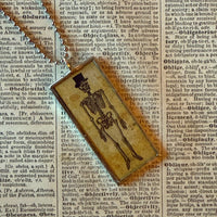 Skeletons, vintage illustrations upcycled to hand-soldered glass pendant