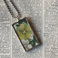 Yellow hibiscus, white lily, botanical illustrations, up-cycled to soldered glass pendant