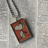 Snoopy, comic strip illustrations from vintage Peanuts book, up-cycled to hand-soldered glass pendant