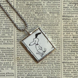 Snoopy, comic strip illustrations from vintage Peanuts book, up-cycled to hand-soldered glass pendant