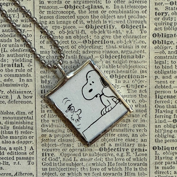 Snoopy, comic strip illustrations from vintage Peanuts book, up-cycled to hand-soldered glass pendant
