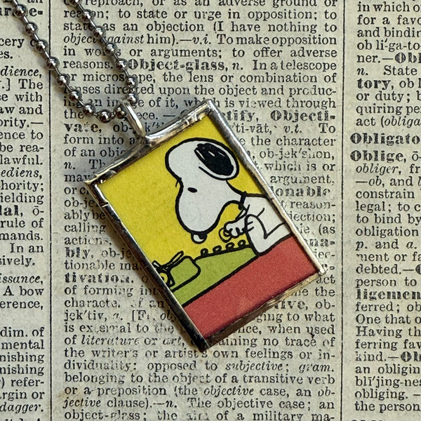 Snoopy, comic strip illustrations from vintage Peanuts book, up-cycled to hand-soldered glass pendant