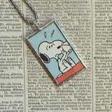 Snoopy, comic strip illustrations from vintage Peanuts book, up-cycled to hand-soldered glass pendant