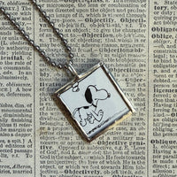 Snoopy, comic strip illustrations from vintage Peanuts book, up-cycled to hand-soldered glass pendant