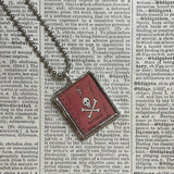 Skull and crossbones, toxic sludge, vintage comic illustrations up-cycled to soldered glass pendant