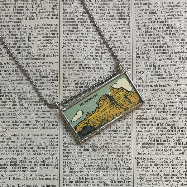 Badlands National Park travel poster, upcycled hand soldered glass pendant