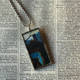 Salvador Dali Persistence of Memory upcycled to hand soldered glass pendant
